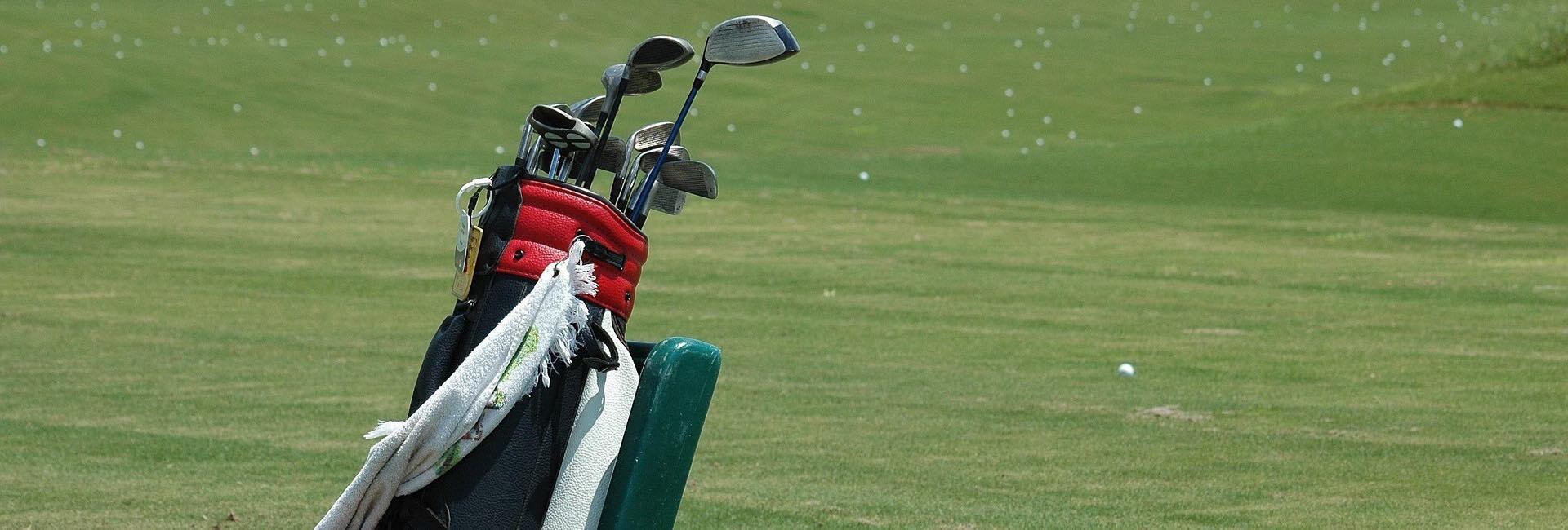 red golf bag with golf clubs inside