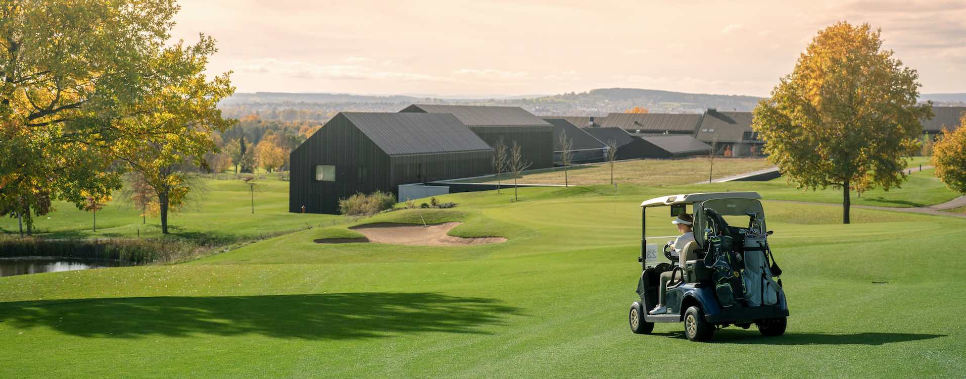 driving golf cart in the middle of the fairway